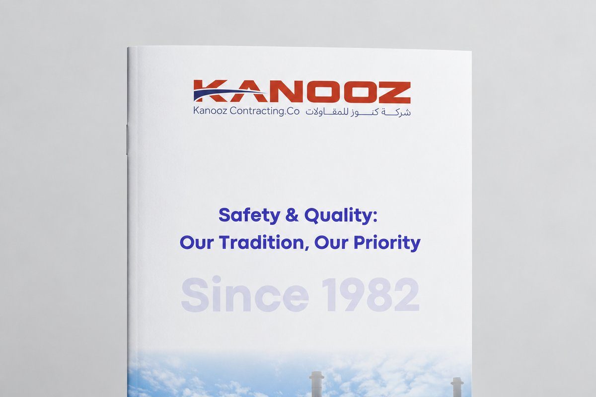 Company profile cover designed for Kanooz Contracting Co., shown as a printed brochure standing on a studio background