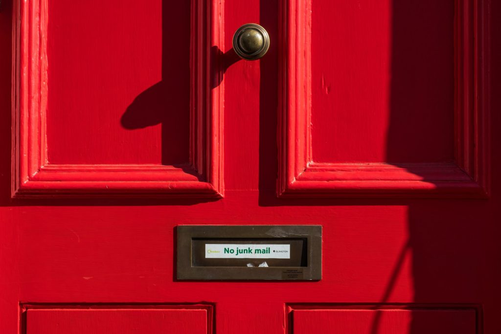 red door with no junk mail sign